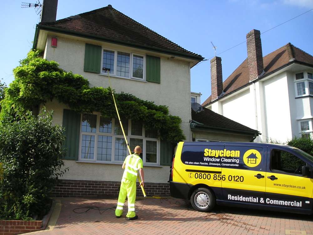 Stayclean cleaner using a water-fed pole at a Bristol home